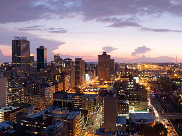 a city with many tall buildings and a road