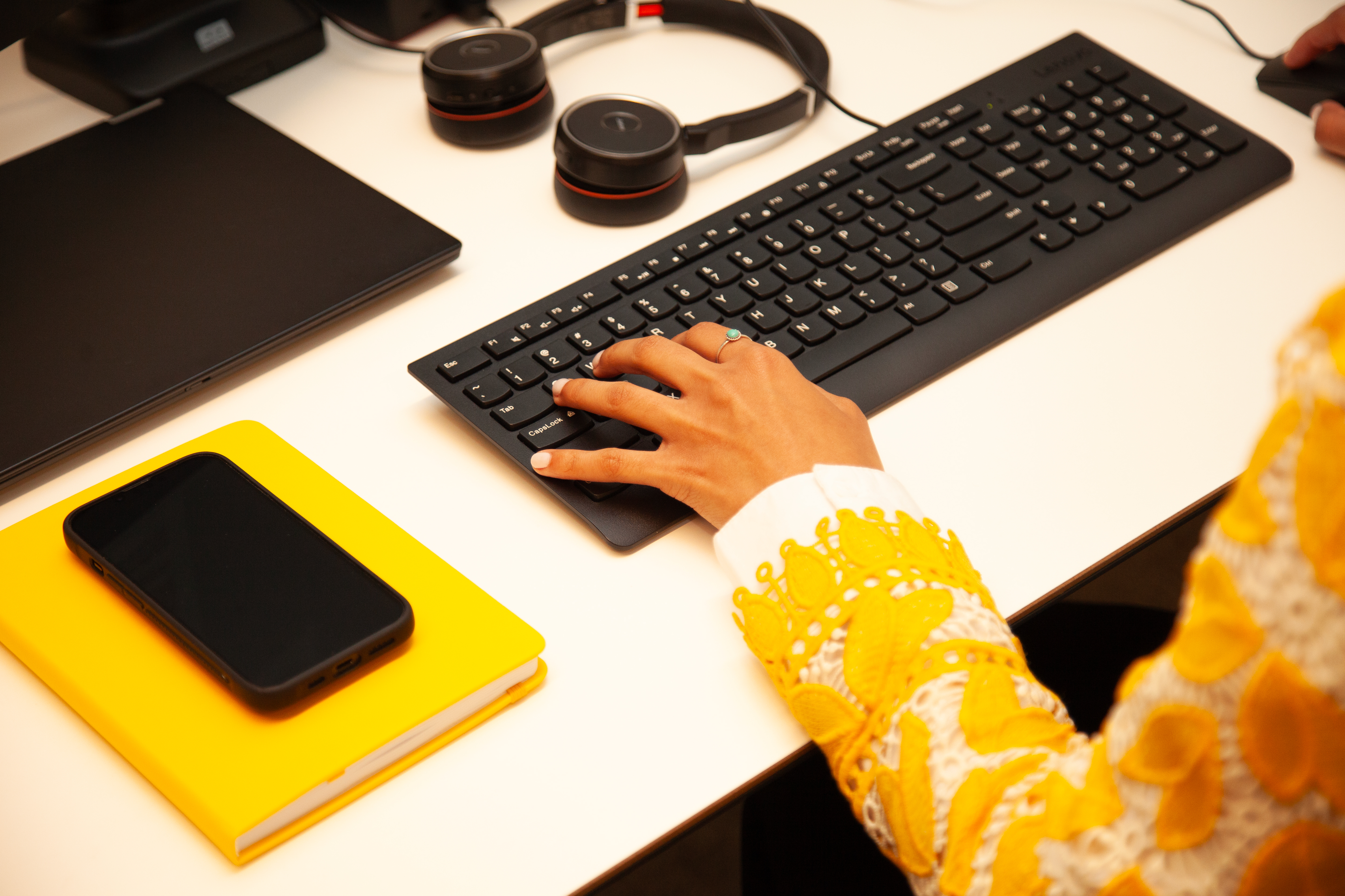 a hand on a keyboard