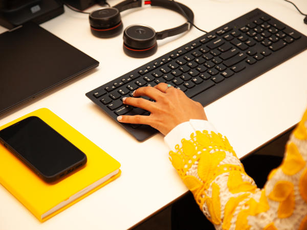 a hand on a keyboard