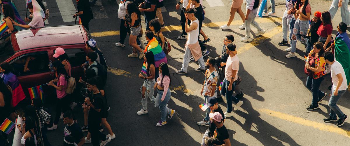 a group of people crossing a street