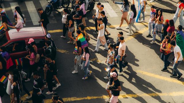 a group of people crossing a street