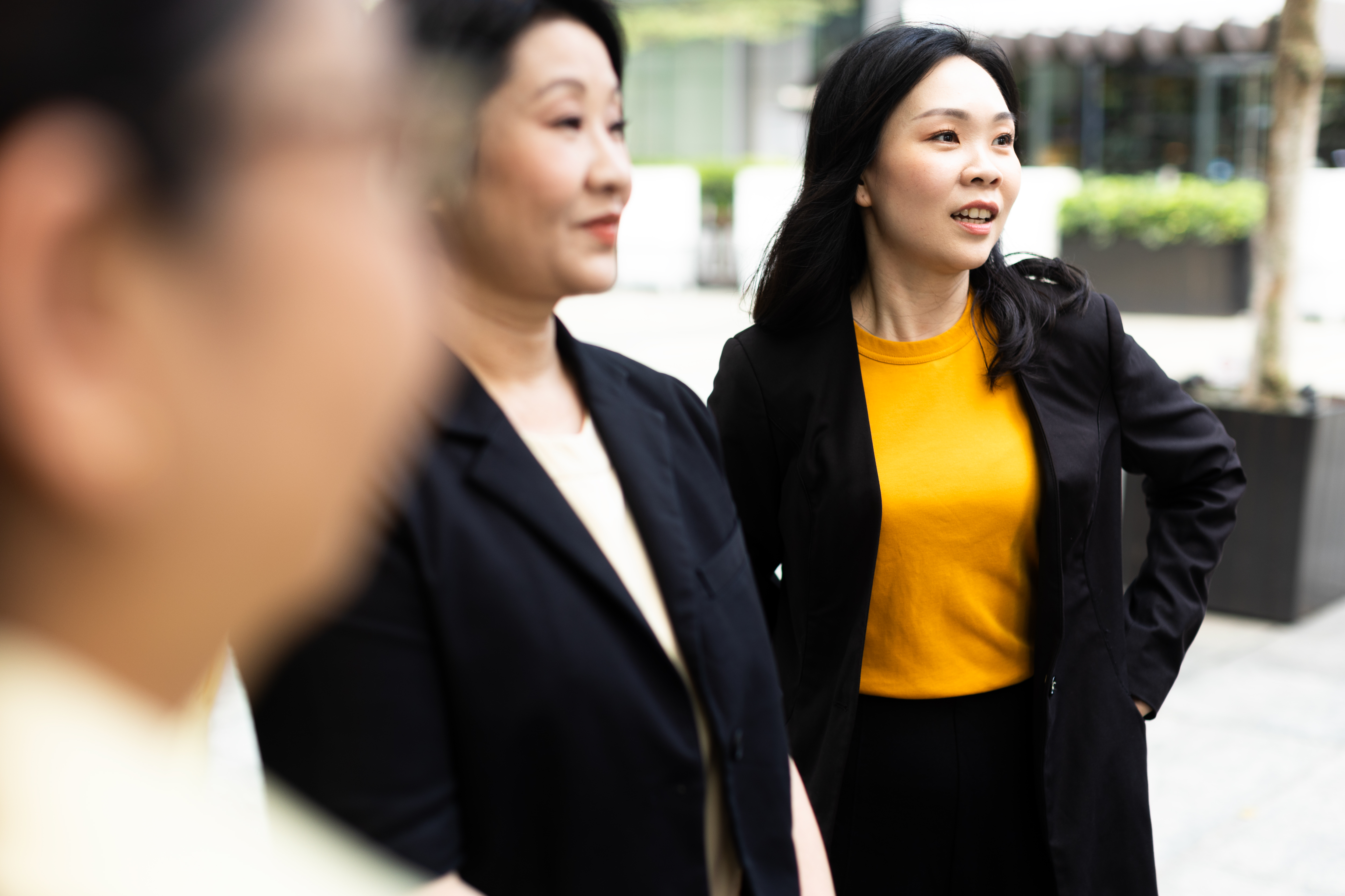 a group of women standing outside