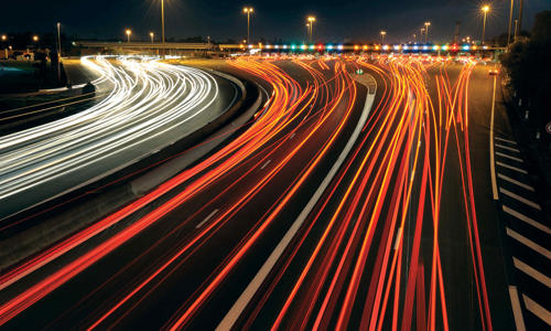 a highway with lights on