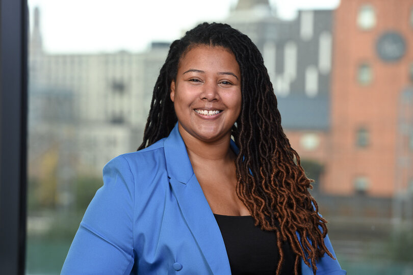 a woman smiling at camera