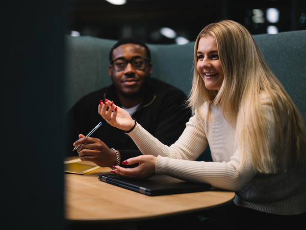 a man and woman sitting at a table