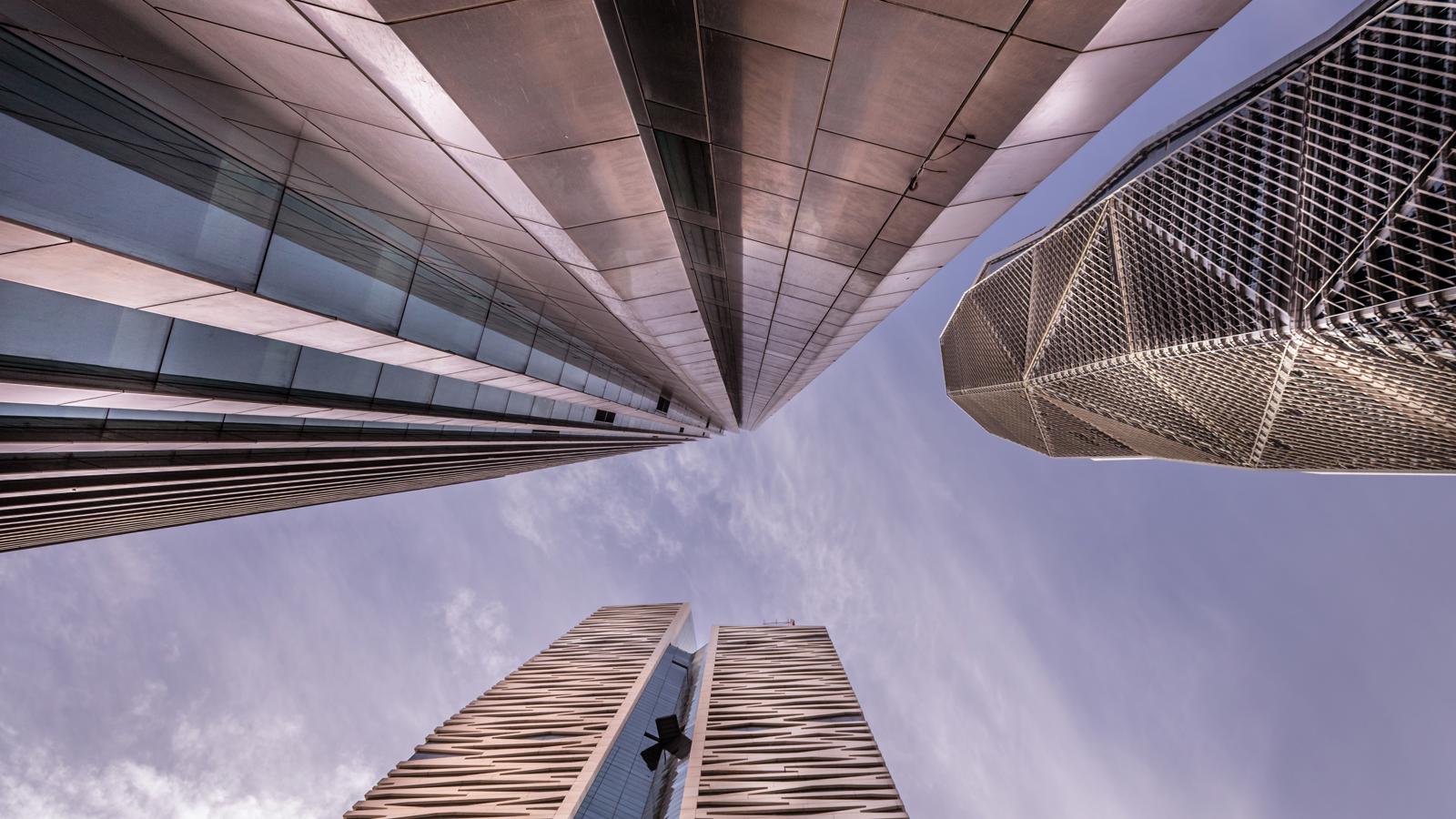 looking up view of tall buildings
