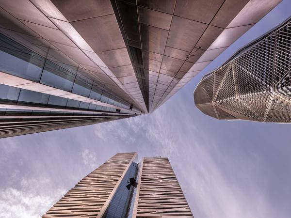 looking up view of tall buildings