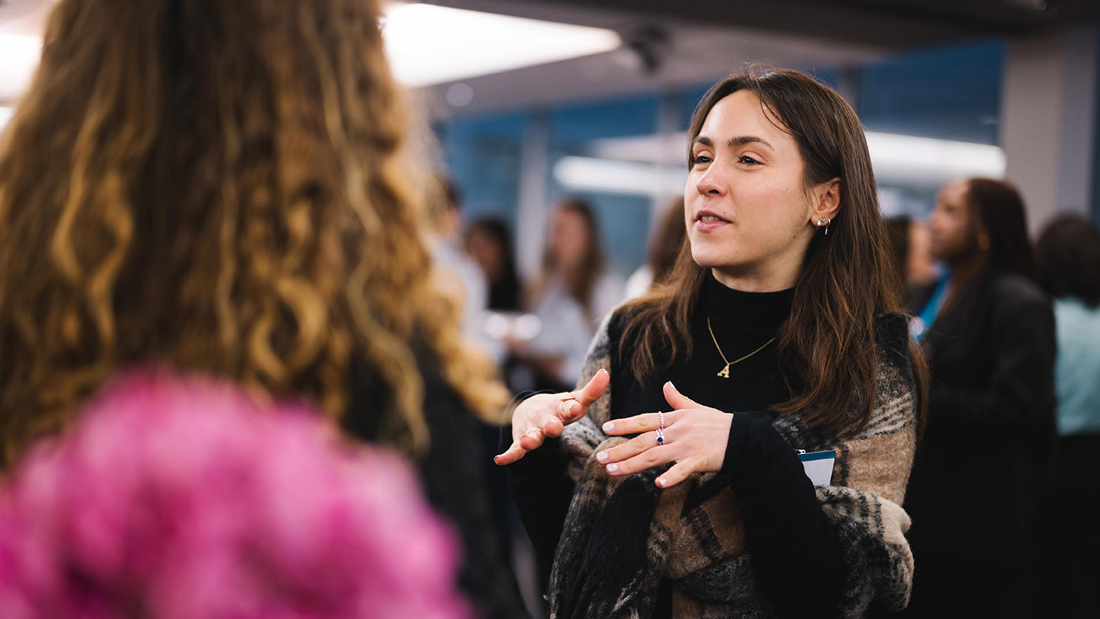 a woman talking to another woman