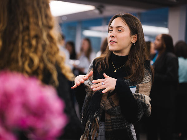 a woman talking to another woman