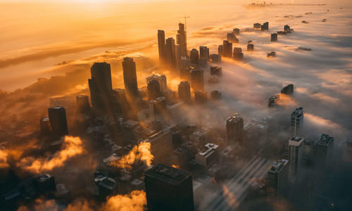 a city with clouds in the sky