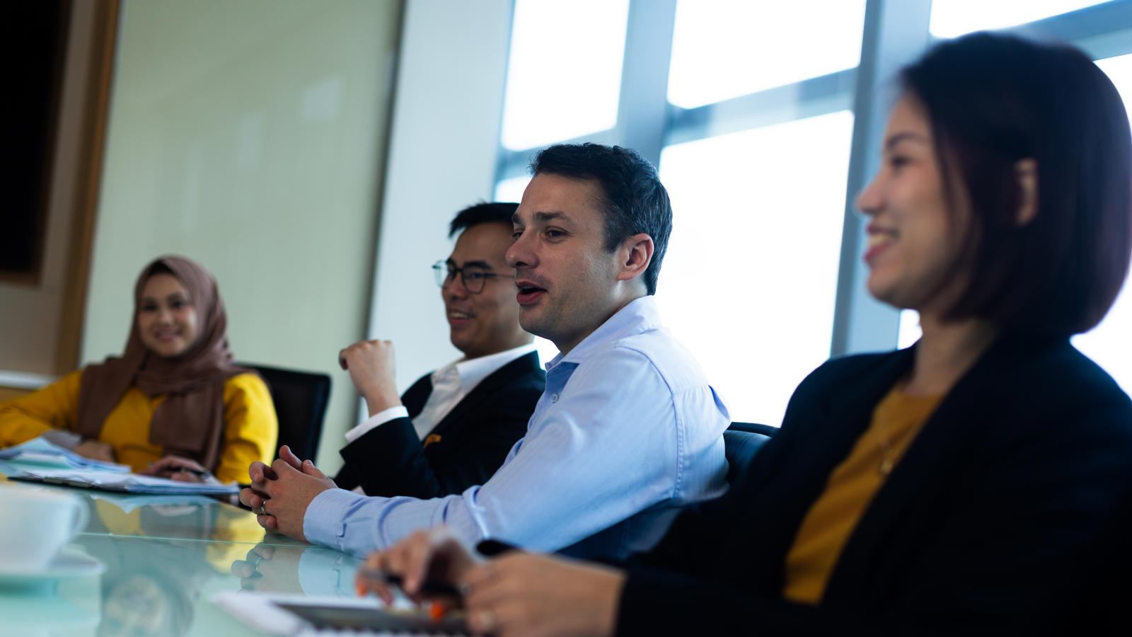 a group of people sitting at a table
