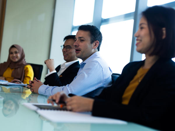 a group of people sitting at a table
