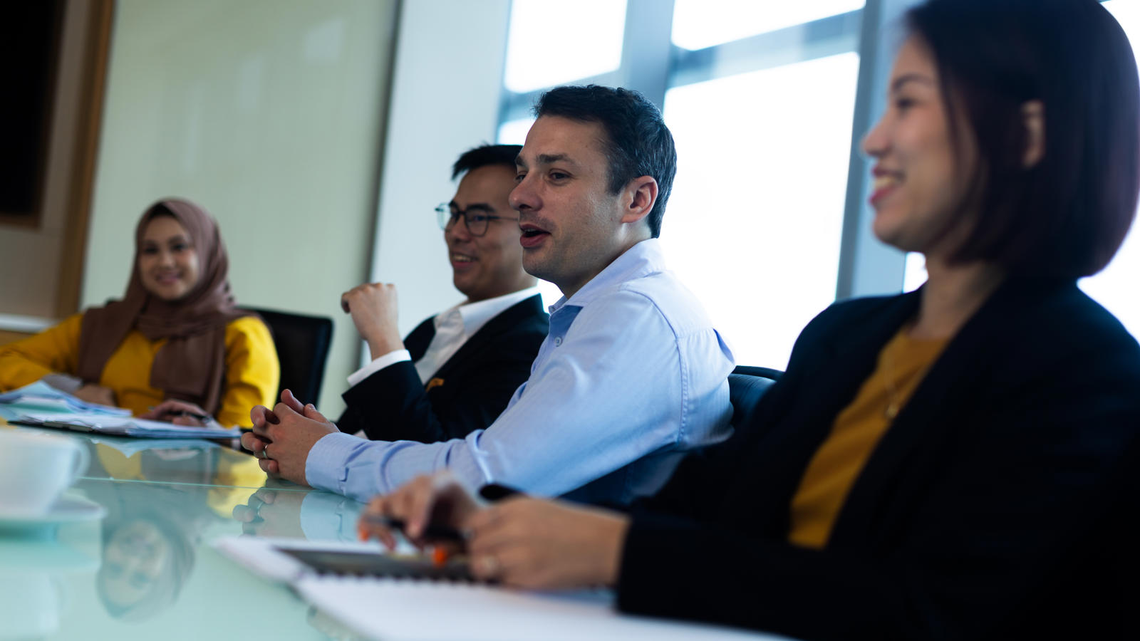a group of people sitting at a table