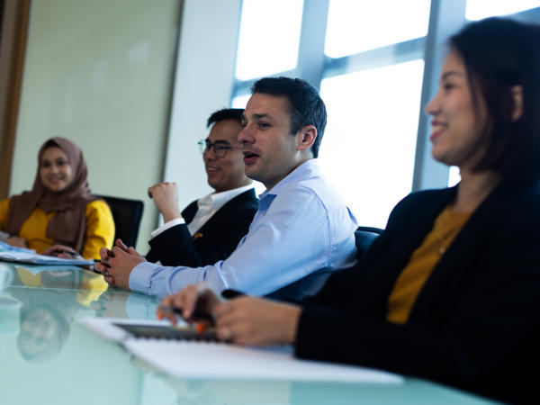 a group of people sitting at a table