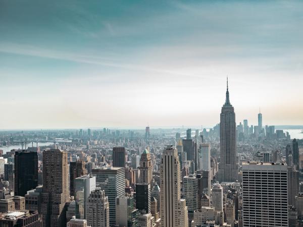 a city skyline with tall buildings