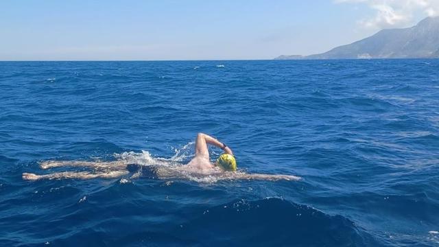 a man swimming in the water