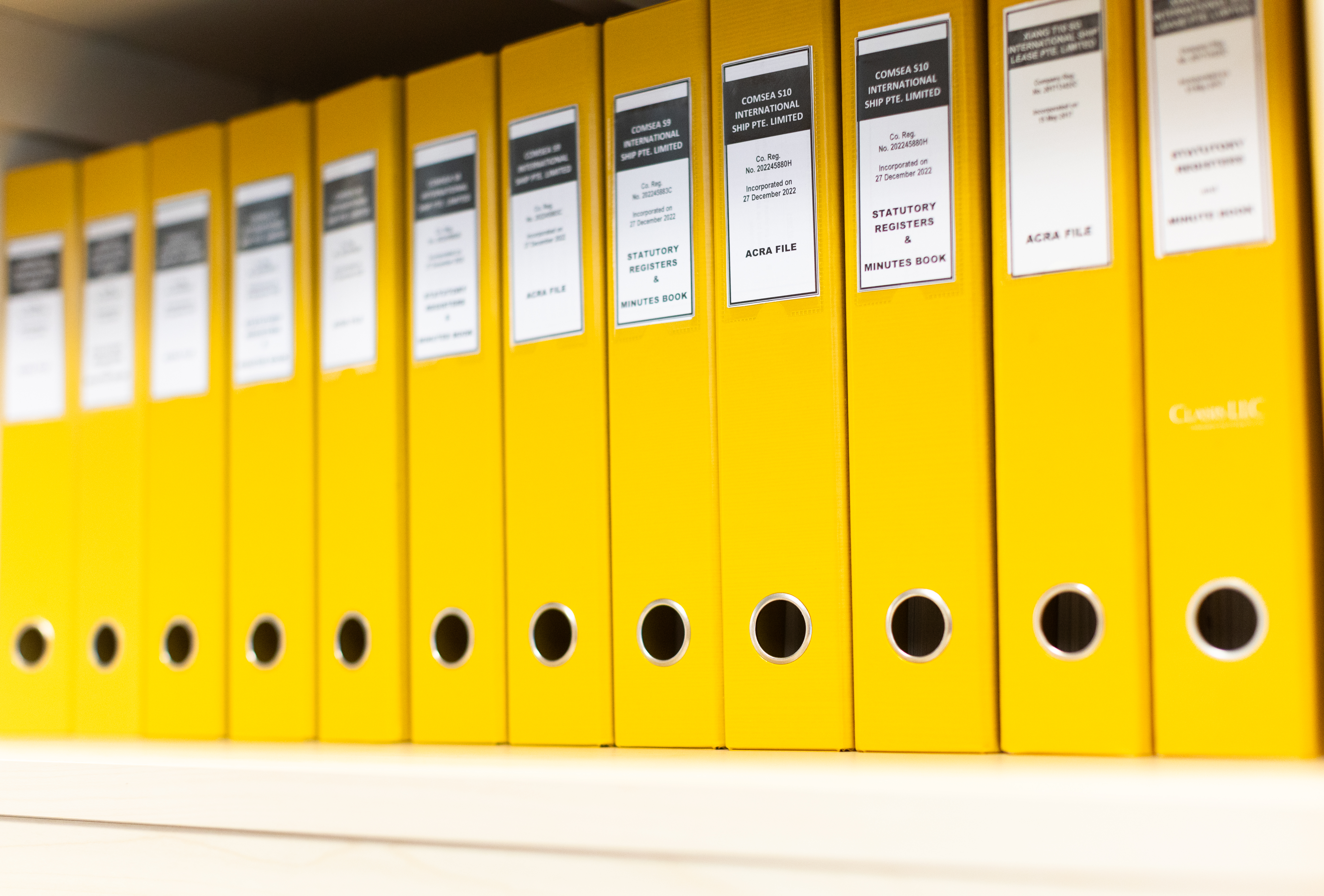 a row of yellow binders