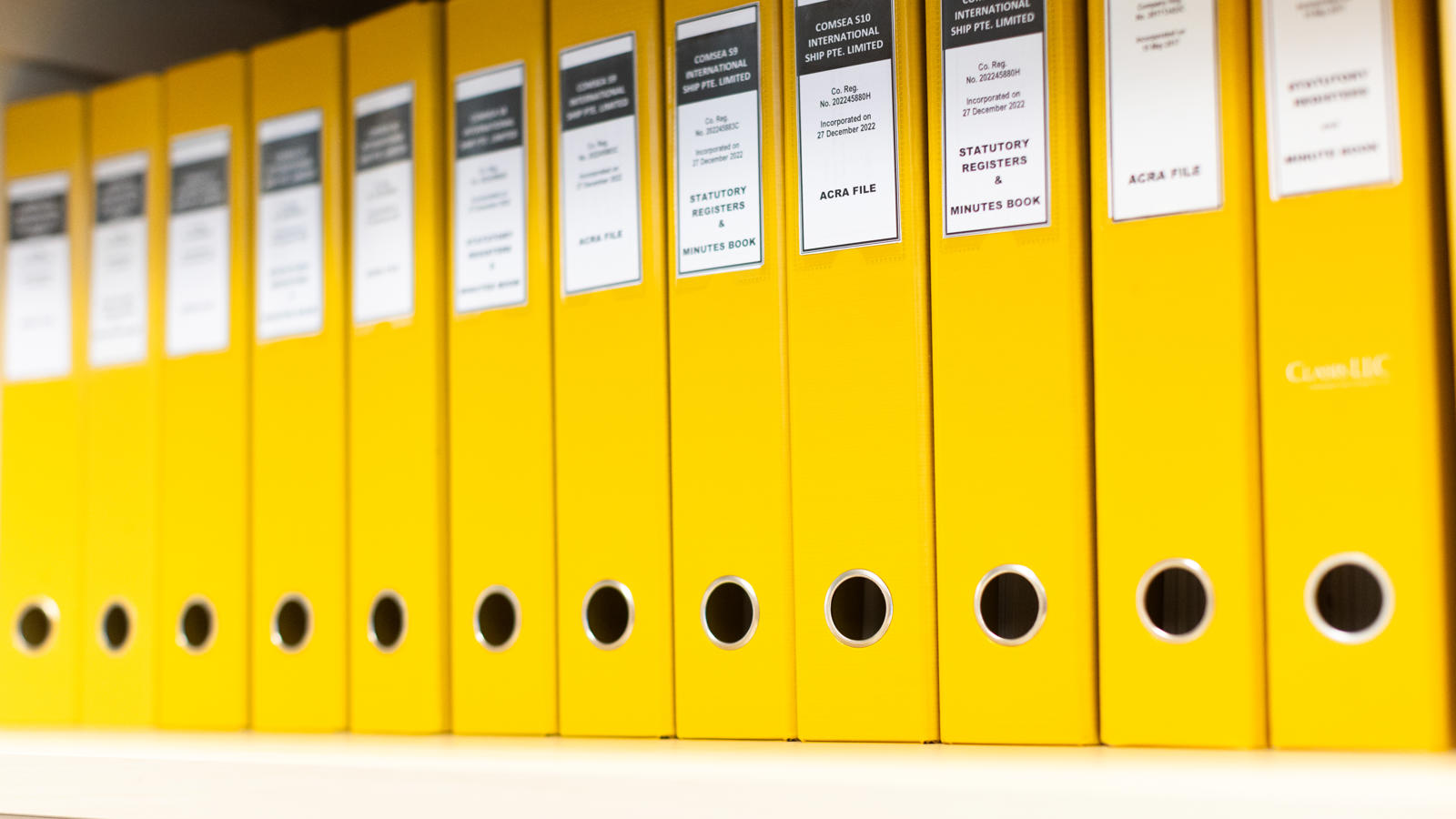 a row of yellow binders