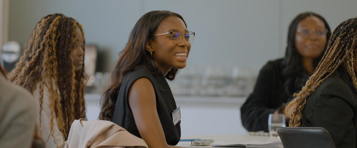 a woman laughing at a table