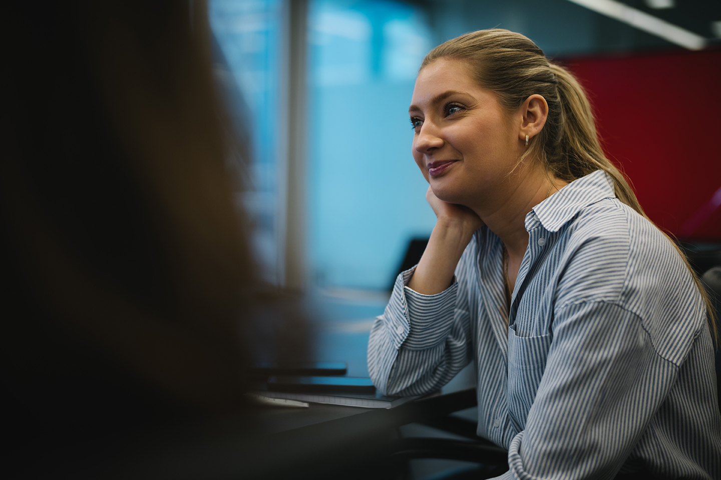 a woman sitting at a desk