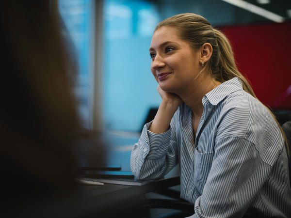 a woman sitting at a desk