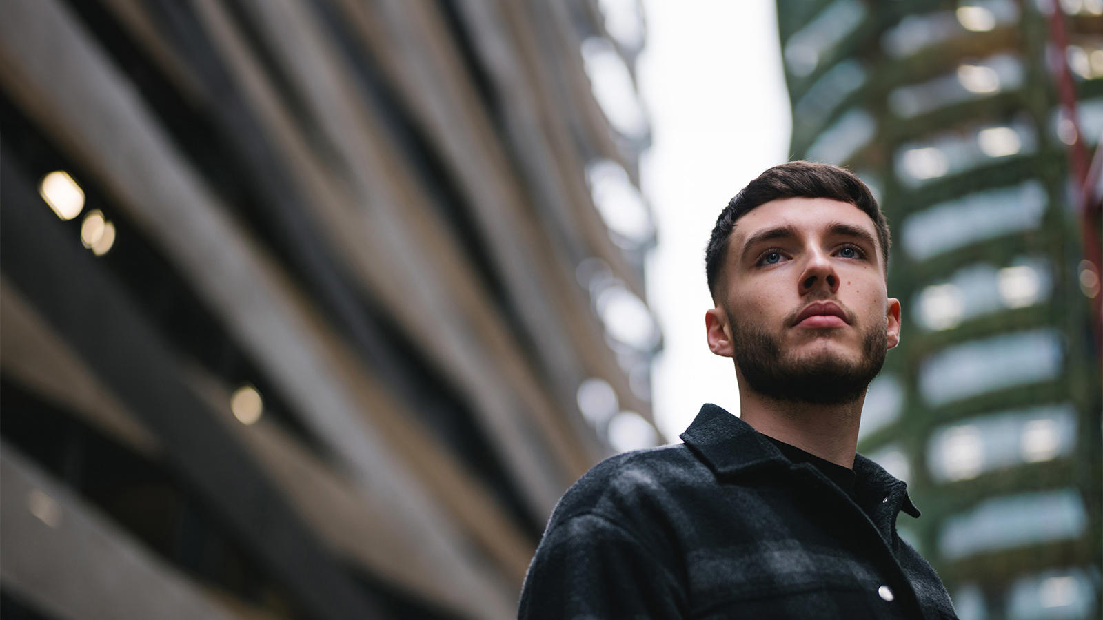a man looking up to the side