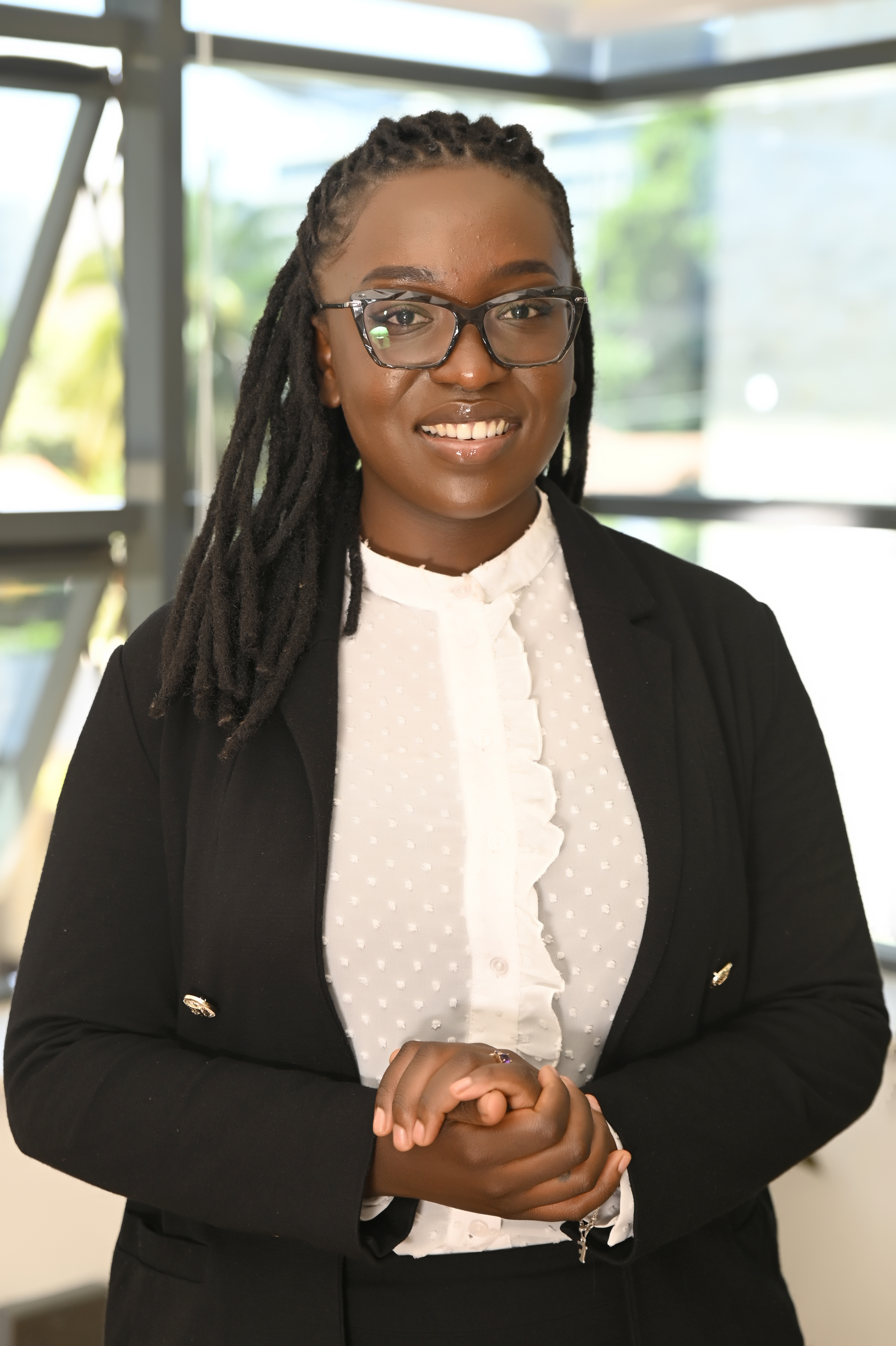 a woman in a suit and glasses