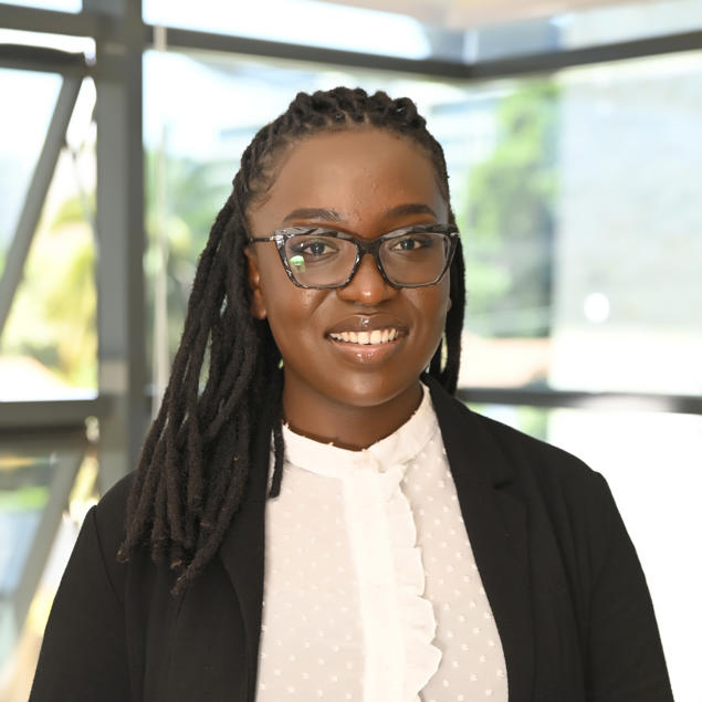 a woman in a suit and glasses