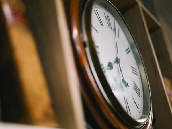 a clock on a shelf
