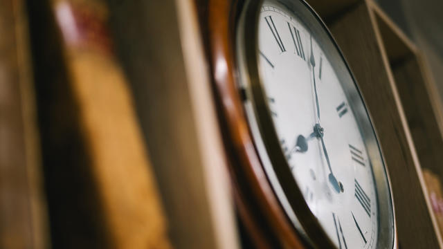 a clock on a shelf