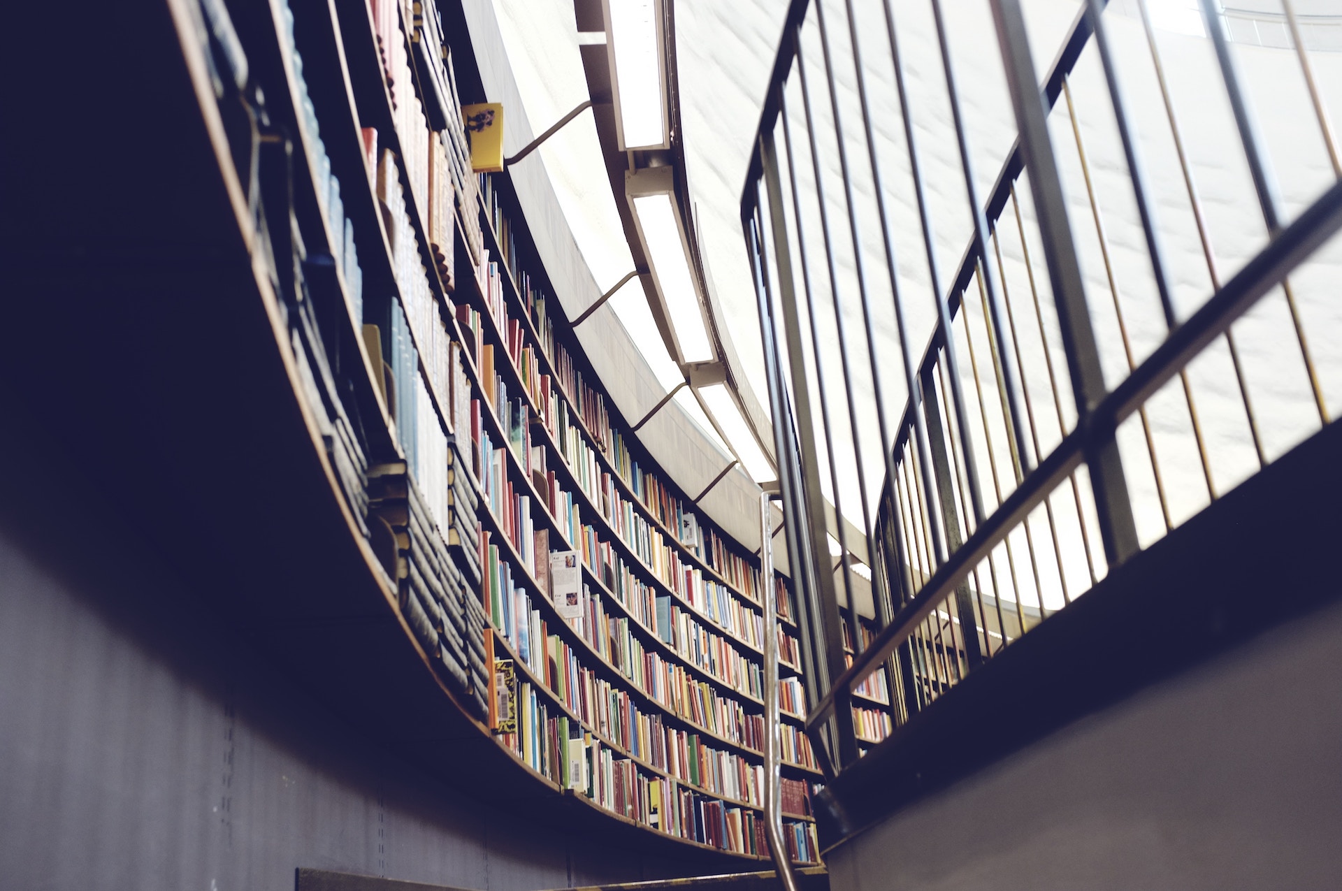 a staircase with books on the shelves