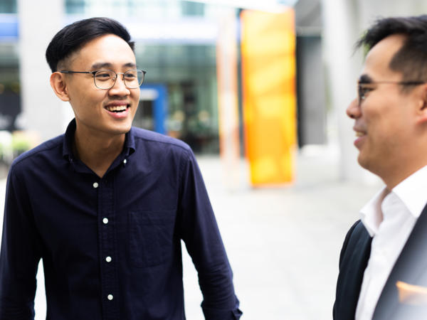 a group of men smiling