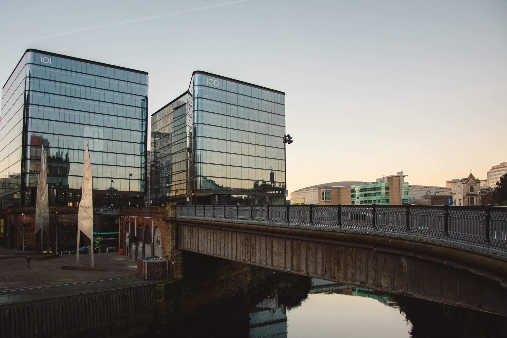 a bridge over a river with a bridge and buildings