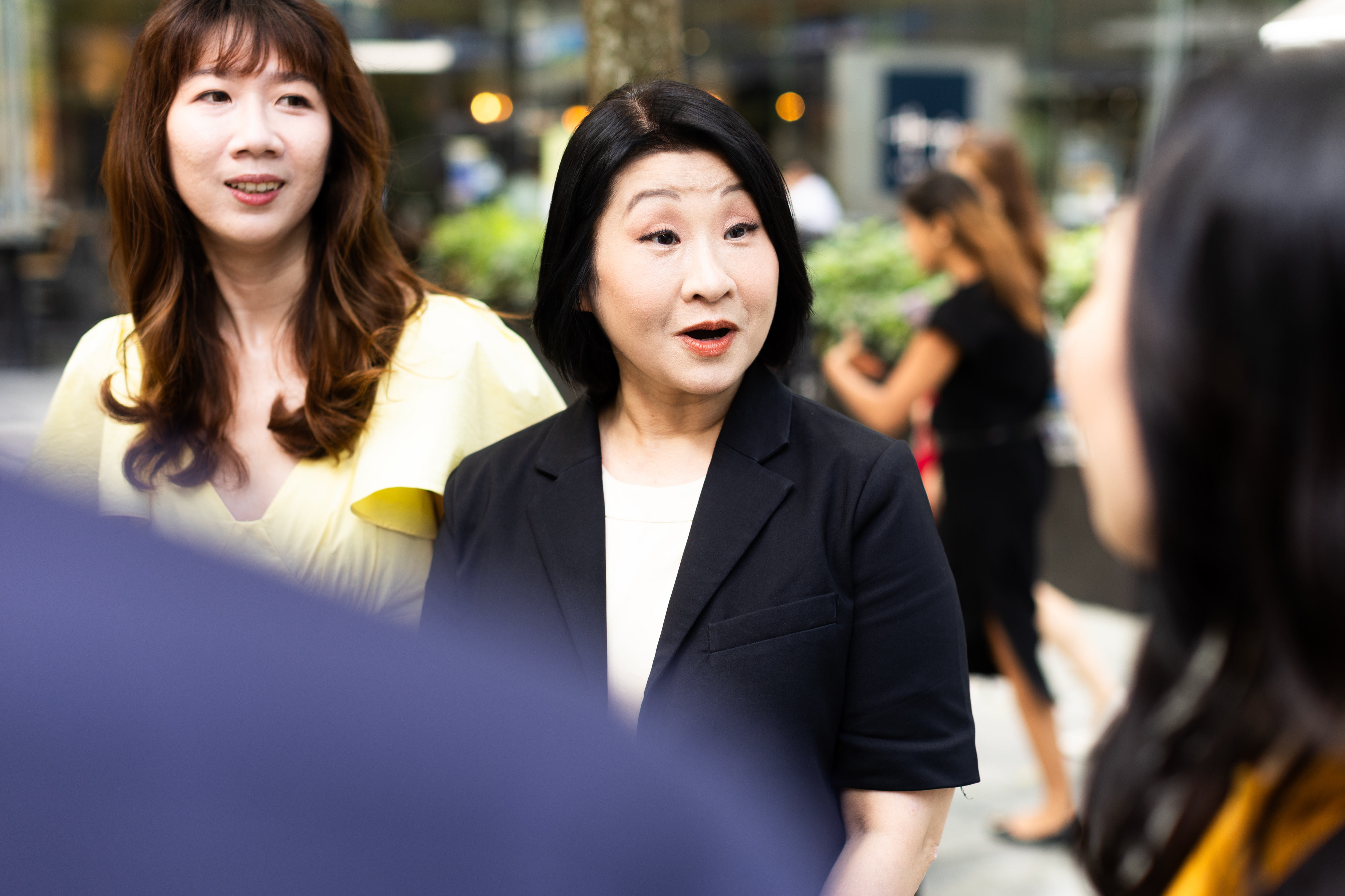 a group of women standing outside