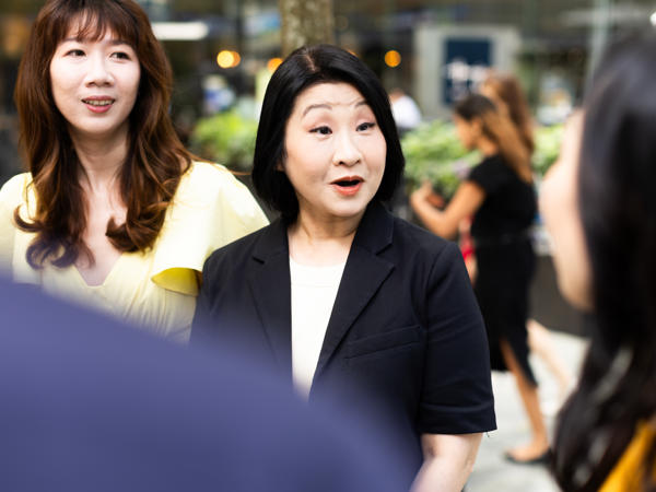 a group of women standing outside