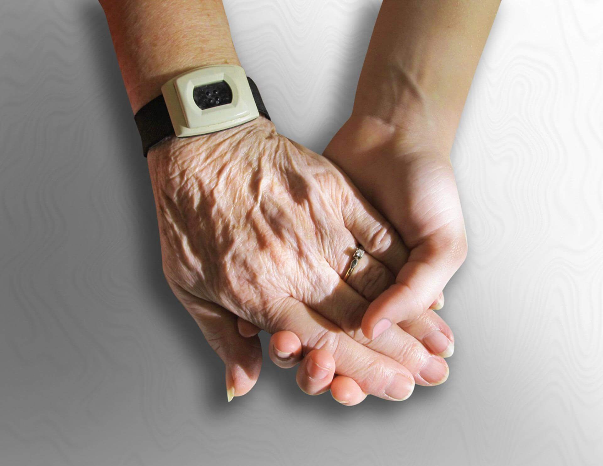 a close-up of hands holding each other