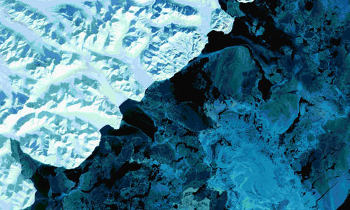 a aerial view of a snowy mountain
