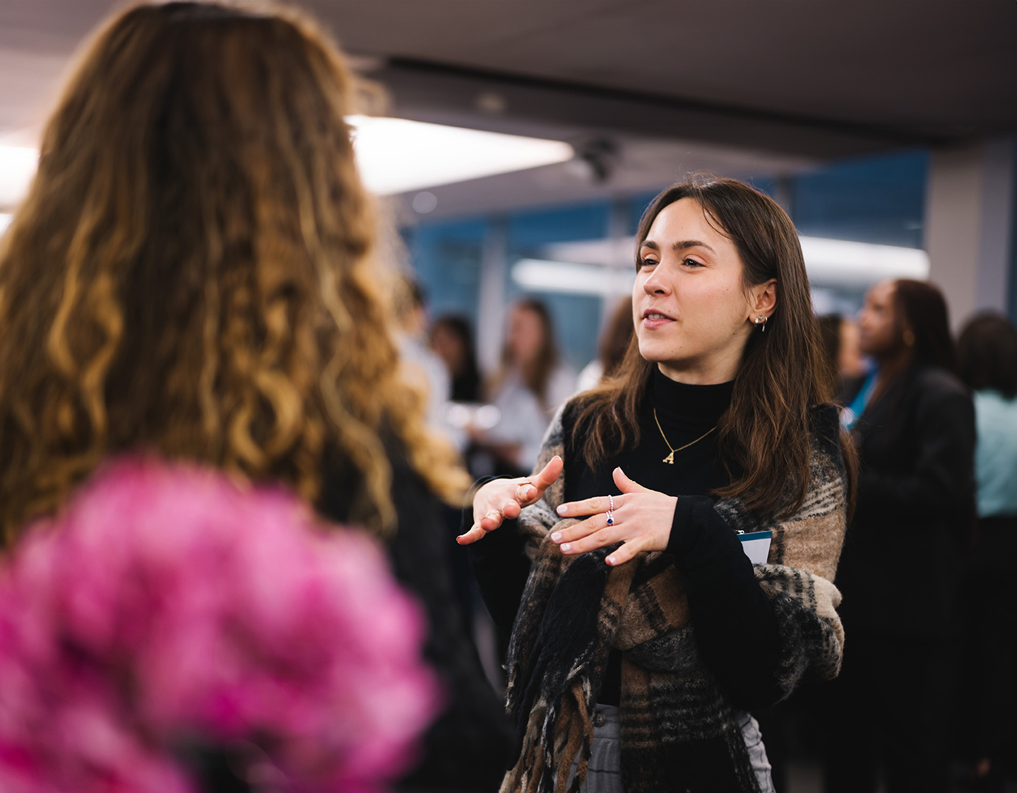 a woman talking to another woman