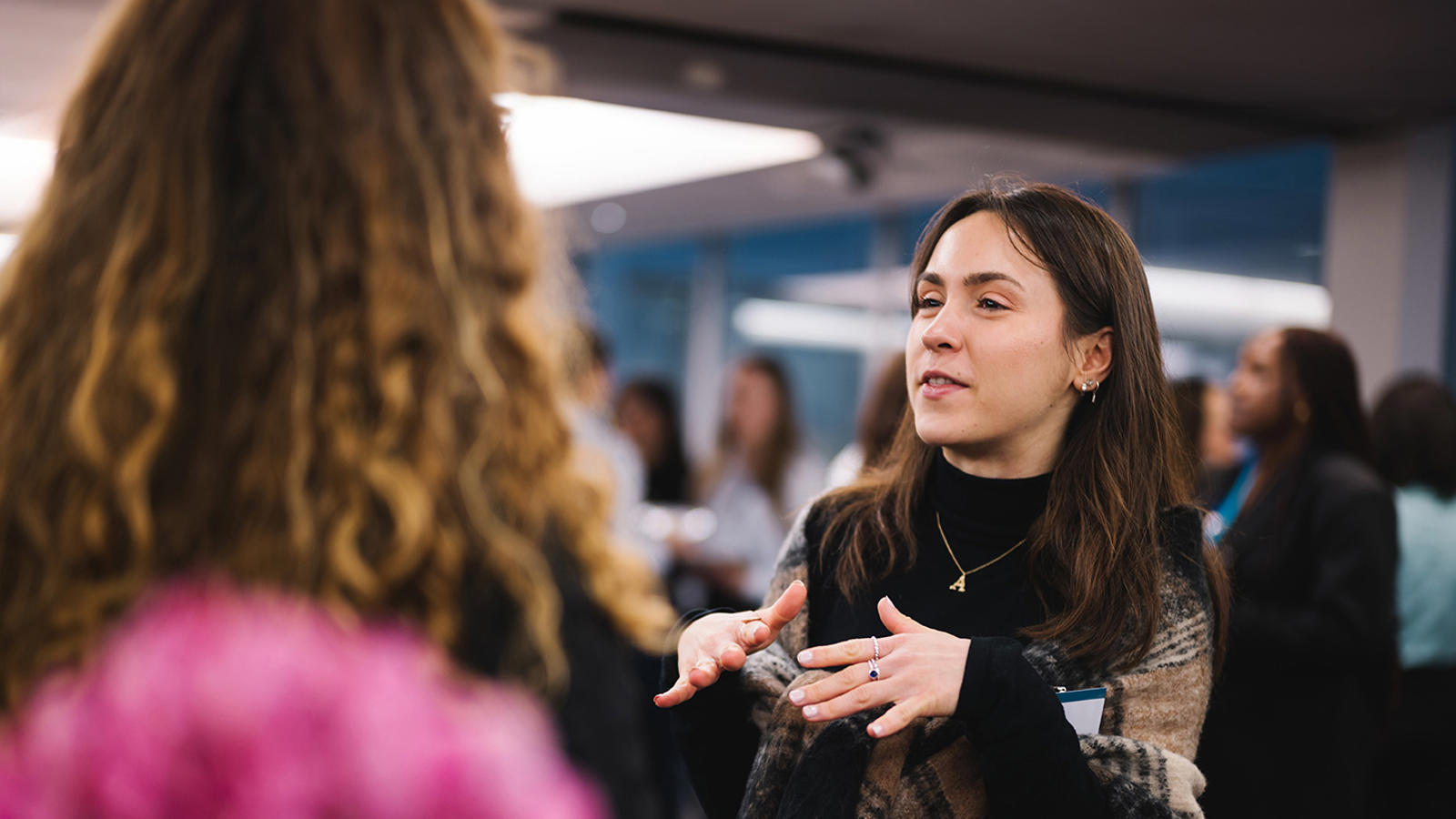 a woman talking to another woman