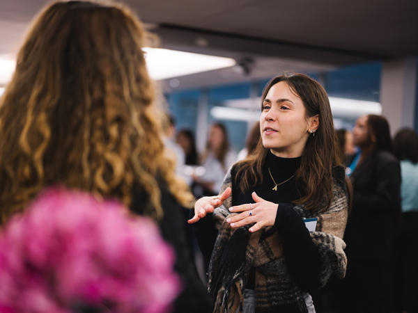 a woman talking to another woman