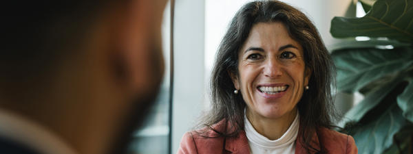 a woman holding a cup of coffee
