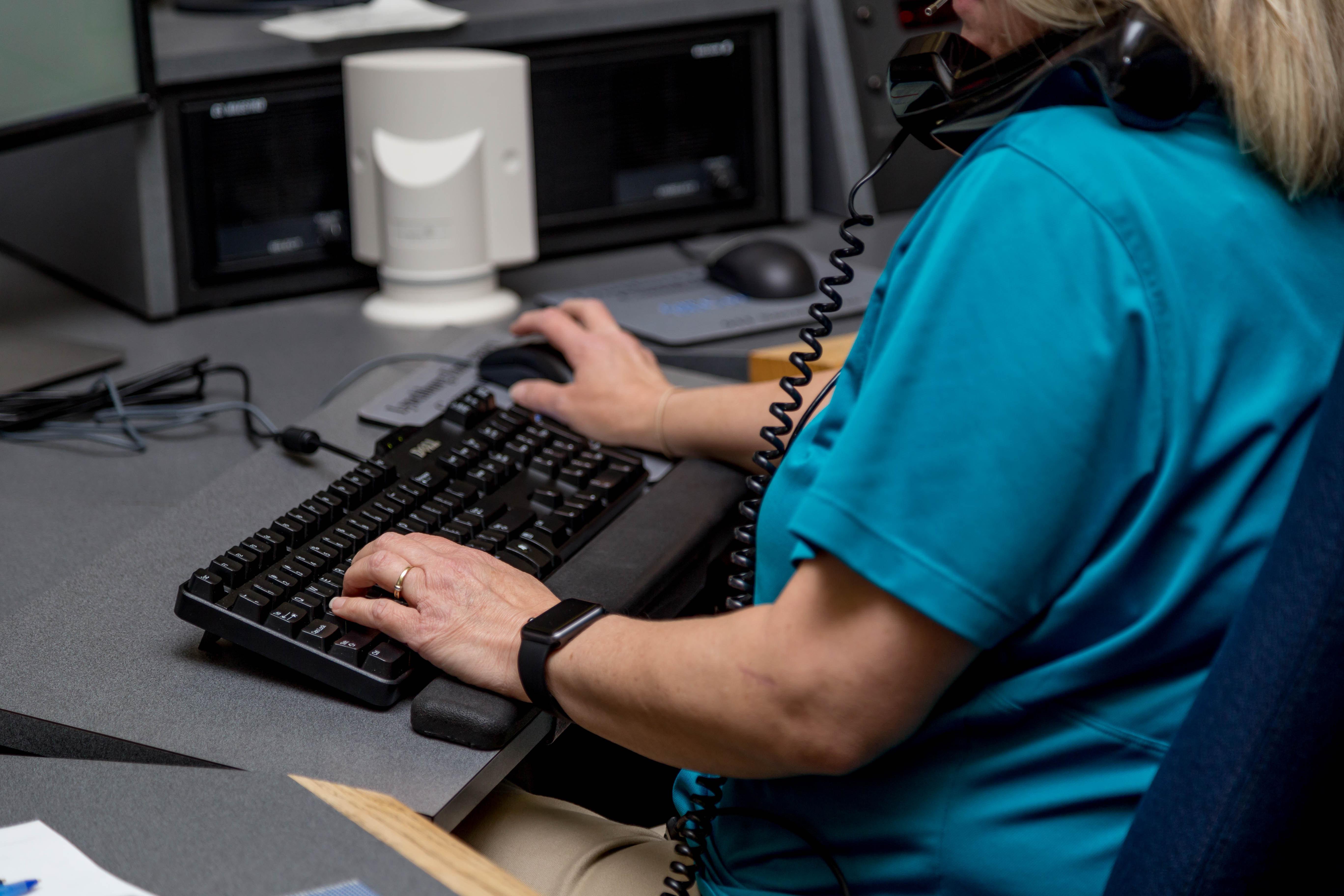 a woman sitting at a computer