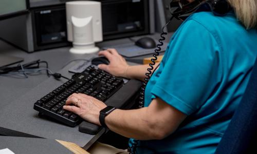 a woman sitting at a computer
