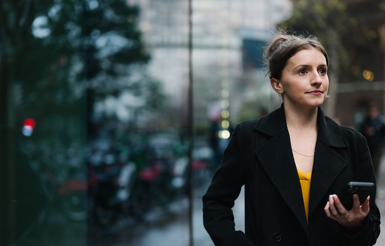 a woman in a black coat
