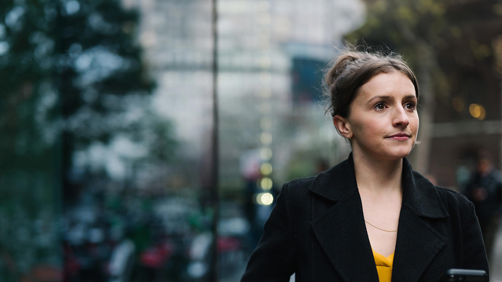 a woman in a black coat