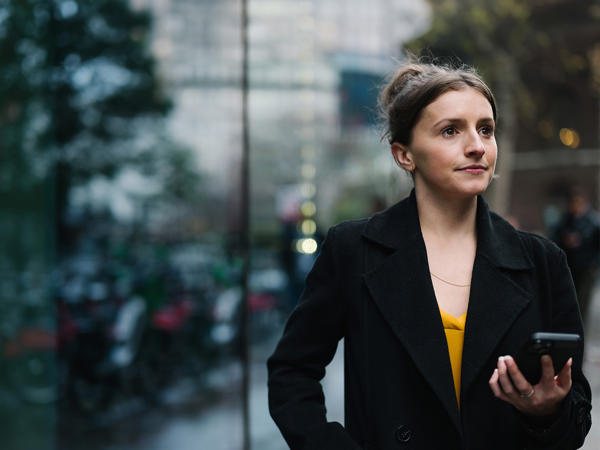 a woman in a black coat
